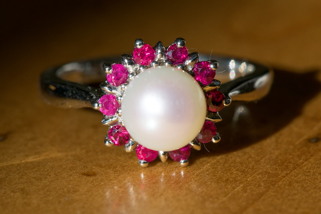 pearl and ruby ring set in white gold