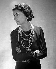 Coco Chanel wearing her signature little black dress and strands and strands of pearls