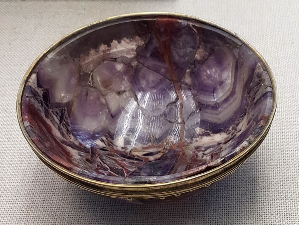 a reassembled amethyst drinking bowl banded around the rim in silver