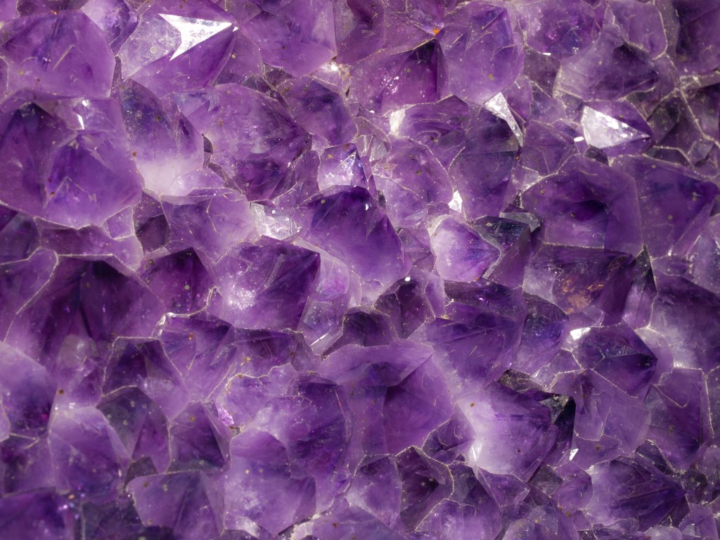 up close image of purple amethyst crystals